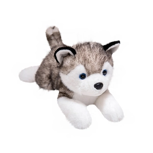 Cute gray and white plush husky puppy dog toy in a lying position on white background