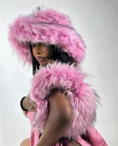 Close-up of pink faux fur texture and vibrant long plush material on a trendy handbag