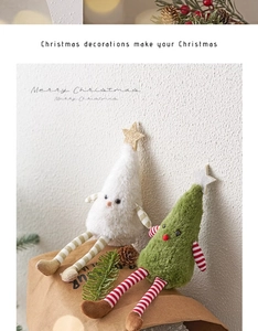 Christmas tree plush toys with long striped legs, pine cones, and festive holiday decor