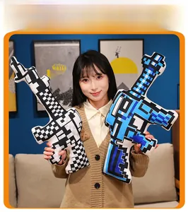 Detailed view of plush pixel-art rifle pillow with blue and white geometric patterns