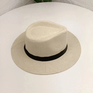 Classic straw Panama hat with black decorative ribbon in a natural beige finish