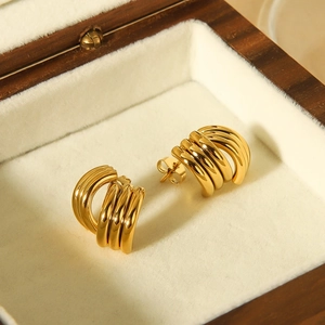 Fashionable 18k gold plated triple layered stainless steel hoop earrings in a jewelry box