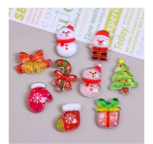 Flat lay of 10 festive resin Christmas charms including Santa, snowmen, and candy canes