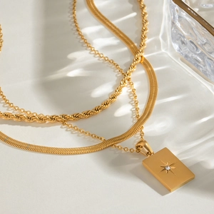 Three-layer gold stainless steel necklace set with starburst square pendant and zircon