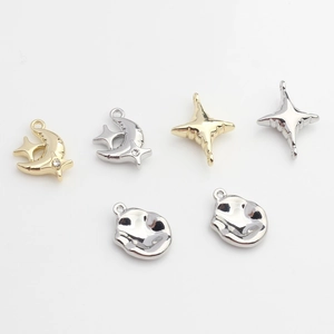 Minimalist alloy star and moon charms in gold and silver finishes for DIY jewelry