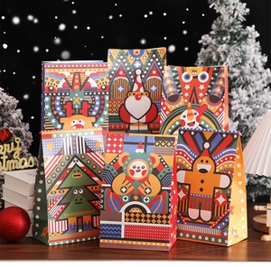 Set of six festive Christmas paper gift bags with colorful cartoon character prints
