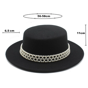 Detail of black wool fedora featuring triple rows of pearl embellishments and sizing specs