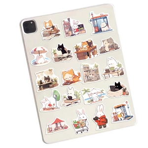 Cute animal doodle stickers shown on the back of a tablet with soft pastel colors