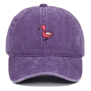 Macro detail of pink flamingo embroidery on vintage washed purple cotton baseball cap