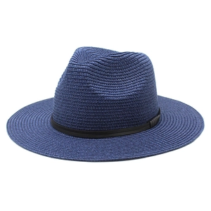 Detailed close-up of dark blue woven straw hat with black decorative ribbon band