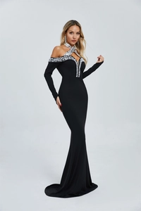 Detail showing hand-sewn pearls and silver sequins on the neck of a black fishtail gown