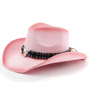 Pink straw western cowboy sun hat with ethnic woven band and bull skull metal ornament