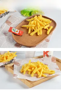 Macro shot of realistic crinkle-cut PVC french fries model with tomato sauce packet