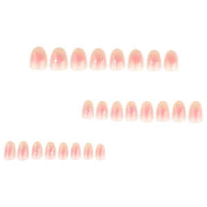 Short round nude pink ombre press-on nails with silver star glitter and sequins