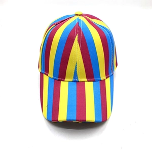 Detailed close-up of rainbow striped baseball cap with red yellow and blue canvas texture