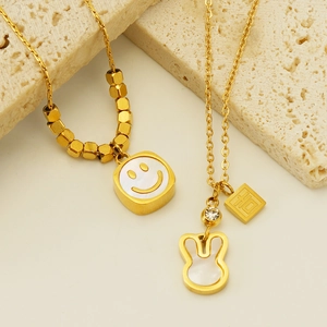 Gold-plated stainless steel necklaces with shell smiley and rabbit pendants on stone decor