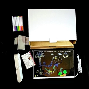 Flat lay of glowing LED drawing board set with stand, 7 colored pens and cleaning cloths