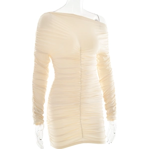 Detail shot of beige off-shoulder dress featuring elegant ruched texture and long sleeves