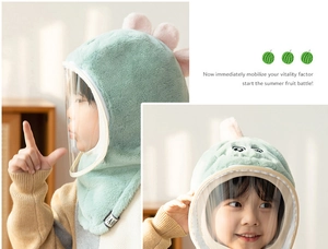 Detail of light green dinosaur plush hat for children with transparent windproof face mask