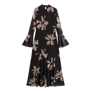 Detailed flat lay of floral print maxi dress with bell sleeves and ruffle hem texture