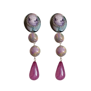 Vintage resin portrait drop earrings with cameo detailing and iridescent beads on white background