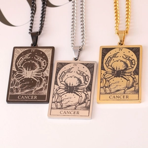 Detailed view of square Cancer zodiac tarot necklaces in black, silver, and gold finish