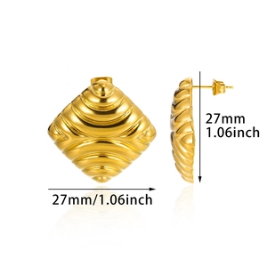 Detailed view of geometric diamond gold earrings featuring 18K gold textured wave relief