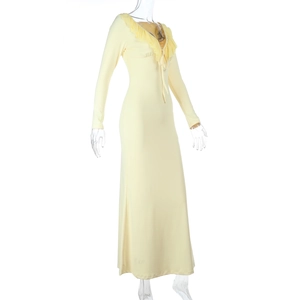 Detail view of the ruffled V-neckline and lace-up design on this light yellow dress