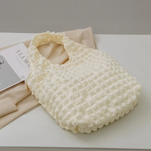 Cream waffle texture bubble shoulder bag with a stylish large capacity design