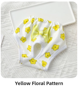 Detail of white cotton dog physiological pants with yellow flower pattern and bow