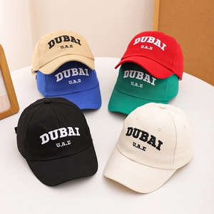 Multiple colors of cotton baseball caps with DUBAI embroidery for kids and parents