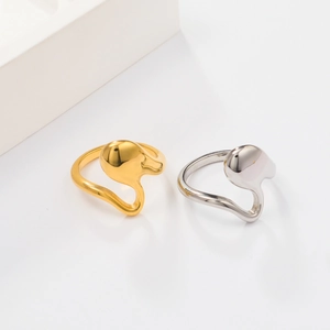 Detailed view of irregular 18K gold and silver plated stainless steel open rings