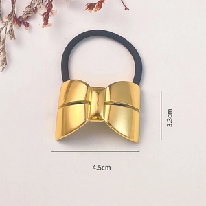 Elegant gold bow elastic hair tie with metallic finish, sized 4.5cm by 3.3cm on beige background