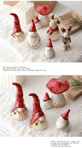 Detail of star-shaped cutouts on ceramic Christmas figurines with smooth glazed finish