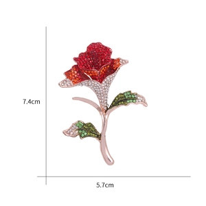 Macro detail of elegant rose brooch with red gradient rhinestones and 7.4cm size mark