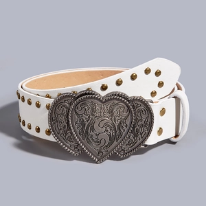 Detail of white leather punk belt with golden studs and vintage silver heart buckle