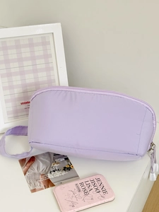 Detailed macro view of lavender cosmetic bag with premium zipper and white cord puller