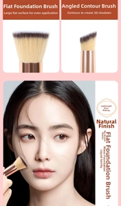 Dual-ended foundation brush detail showing flat head and angled contour brush bristles