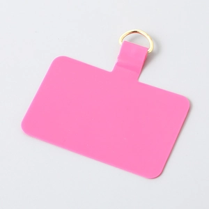 Close-up of rose pink TPU phone lanyard patch with premium gold metal D-ring buckle