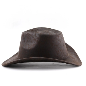 Macro view of dark brown western cowboy hat with vintage cracked faux leather texture