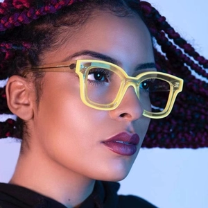 Close-up of TR90 square glasses in transparent amber yellow on a female model