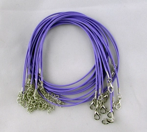 Close-up of purple waxed cord necklace with silver lobster clasp and extender chain