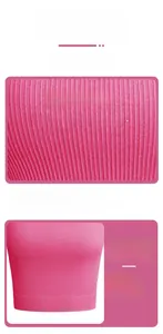 Macro shot of pink ribbed yoga vest showing soft seamless fabric and wide hem detail