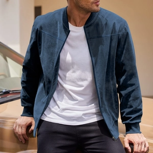 Detail of navy blue suede bomber jacket with metallic zipper and ribbed knit cuffs