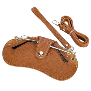 Brown lychee texture leather glasses pouch with neck strap and fine white stitching