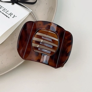 Vintage tortoise shell pattern acetate hair clip in a rectangular minimalist hollow design