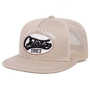 Detail of Chicago 1967 embroidery on breathable mesh khaki trucker hat in vintage style