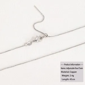 Detailed macro view of a 45cm silver box chain with lobster clasp and sliding bead