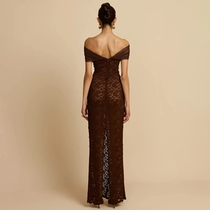Detail of deep brown lace evening dress featuring an open back and elegant slit design