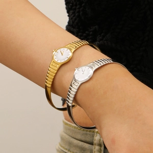 Minimalist stainless steel cuff watch with textured strap in gold and silver finish